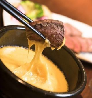 Roasted beef skirt steak with cheese fondue sauce