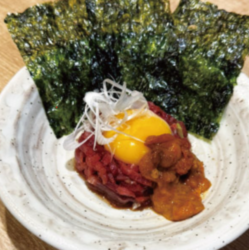 My A5 Kuroge Wagyu beef yukhoe style topped with luxurious and rich sea urchin