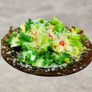 Snow-covered cheese Caesar salad with soft-boiled egg