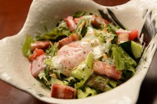 Warm Caesar salad with thick-sliced bacon