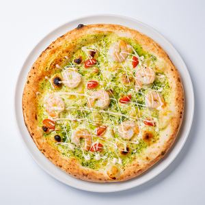 Pizza with plenty of plump shrimp and pesto