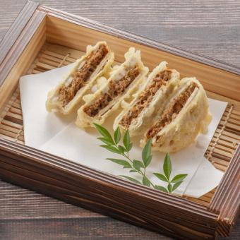Deep-fried lotus root sandwiched in duck miso sauce