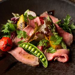 Domestic beef tagliata and colorful vegetable grille