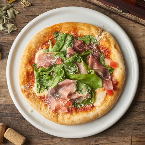 Prosciutto and arugula pizza