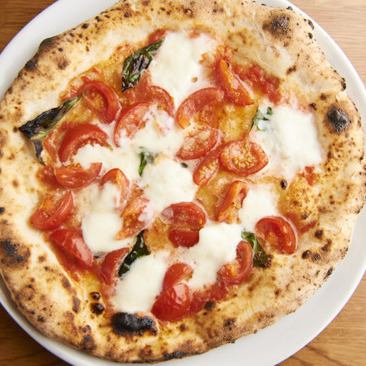 Proud authentic Neapolitan pizza baked in a wood kiln