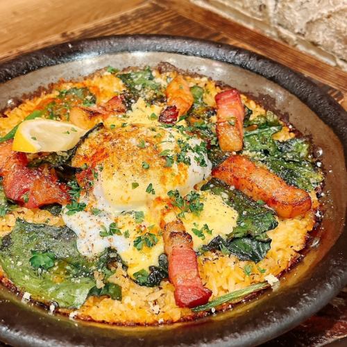 Paella with curly spinach and Iberian bacon