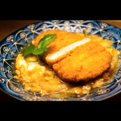 Soft and fluffy egg stewed with pork loin cutlet