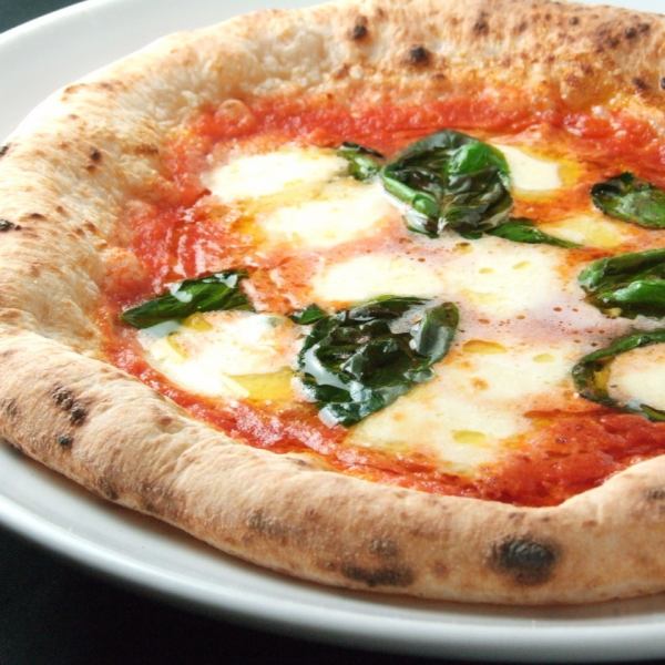 Margherita baked in a large wood-fired oven