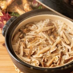 Rice with white fish and whitebait in a clay pot