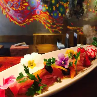 Tuna and salmon carpaccio with salted kelp and pickled eggplant.