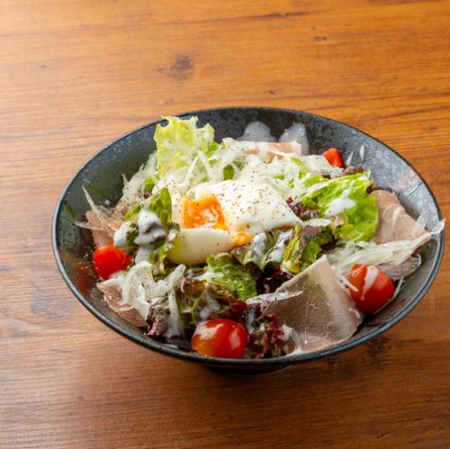 Caesar salad with horse ham and chicken and soft-boiled egg