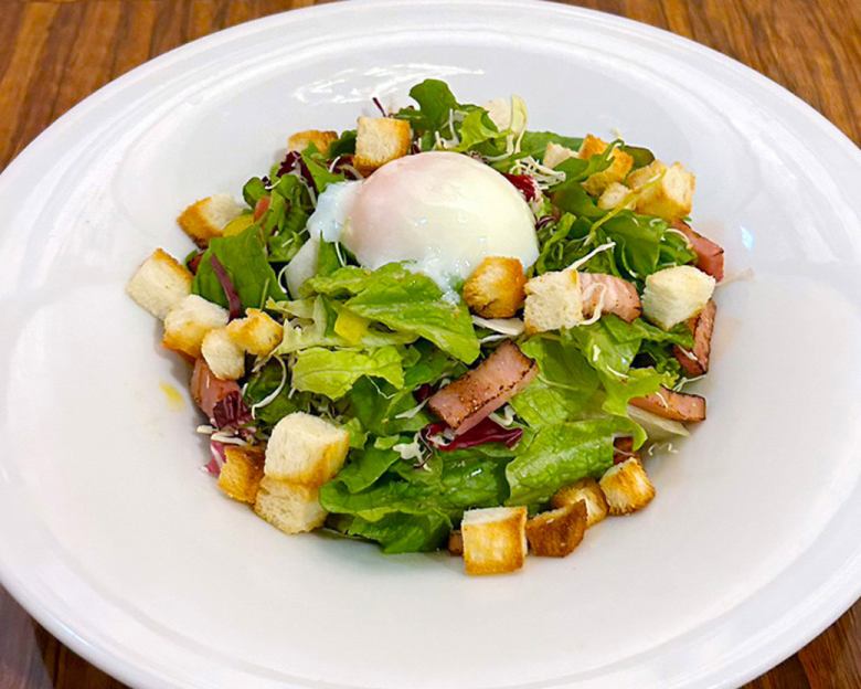 Caesar salad with smoked bacon and hot spring egg