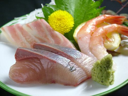 Sea bream sashimi, squid sashimi, yellowtail sashimi, tuna sashimi