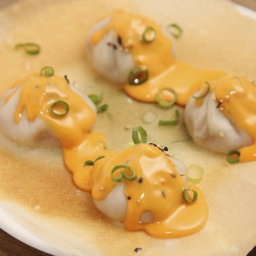 Grilled xiao long bao with gooey cheese wings