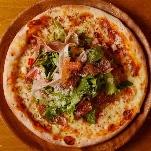 Prosciutto and herb salad pizza