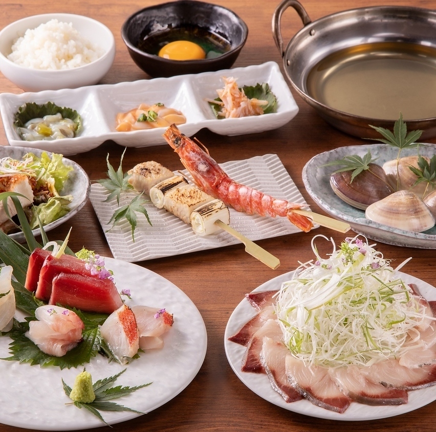 A seafood izakaya in Shinbashi/Shiodome offering fresh fish delivered directly from Toyosu, yellowtail shabu-shabu, and TWG and Ippodo green tea highballs.