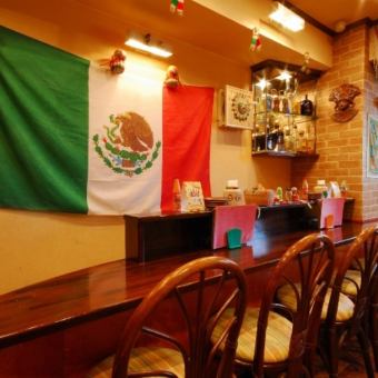 Counter seats where the Mexican flag emits a presence