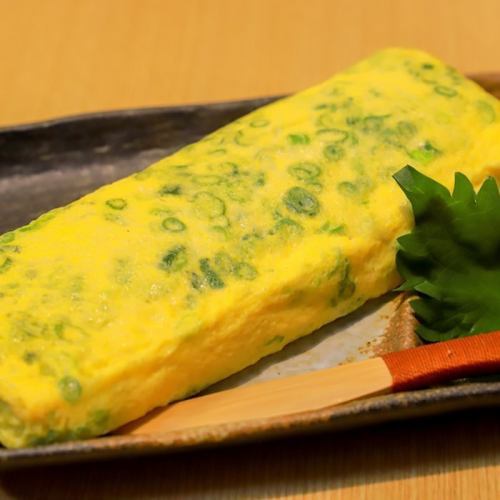 Rolled egg with lots of green onions