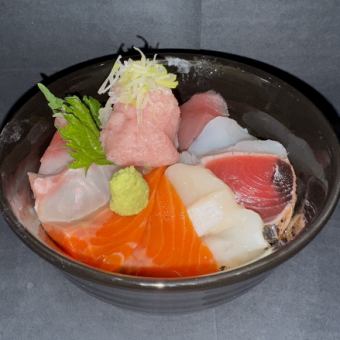 Bowl of rice topped with sashimi