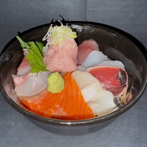 Bowl of rice topped with sashimi