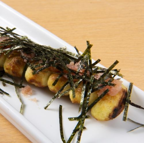 Iron skewered gnocchi with cod roe topped with seaweed