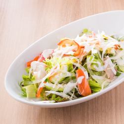 Caesar salad with fresh fish and avocado