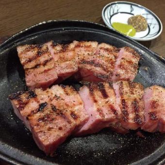 Thick-sliced bacon grilled over binchotan charcoal