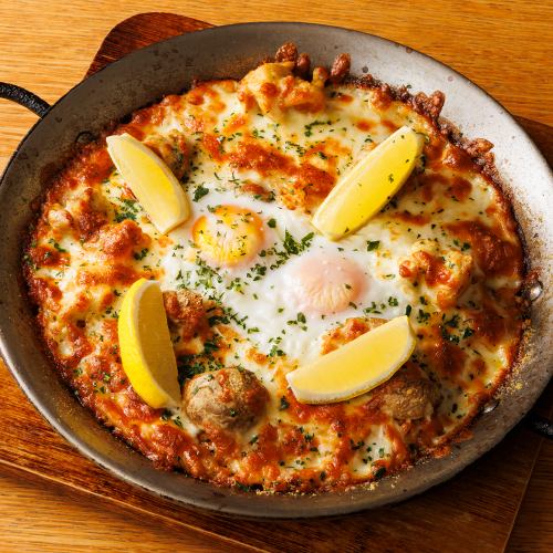 Chicken, soft-boiled egg, mushroom and cheese paella