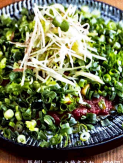 Horse meat - horse sashimi covered in garlic and green onions