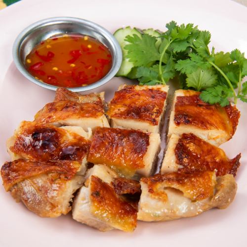 Charcoal-grilled chicken popular at Thai food stalls and restaurants