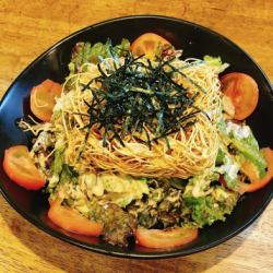 Crispy noodles in a plate of udon salad