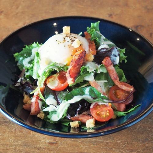 Caesar salad with soft-boiled egg and smoked bacon