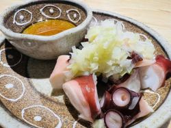 Octopus covered in salt and green onions