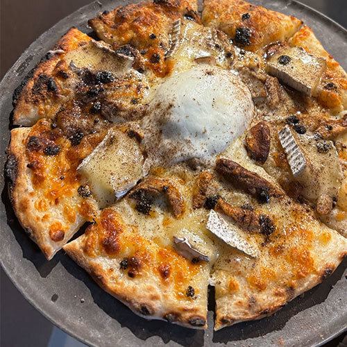 Burrata pizza baked in a stone oven with the aroma of truffles