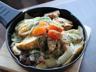 Potato and salsiccia baked with melted cheese