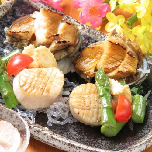 Grilled abalone and scallops in butter