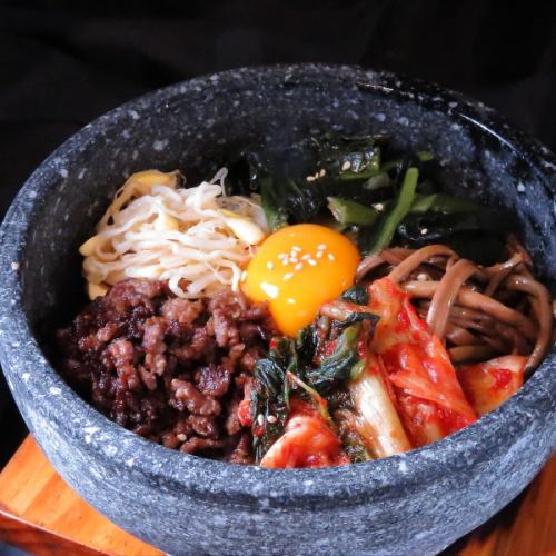 Delicious bibimbap served in a piping hot stone pot!