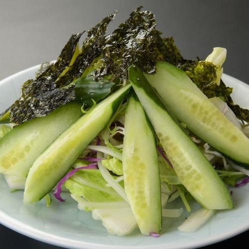 Choregi salad with leafy vegetables and cucumber