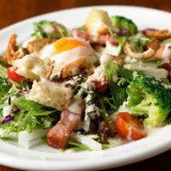 Caesar salad with thick-sliced bacon and soft-boiled egg