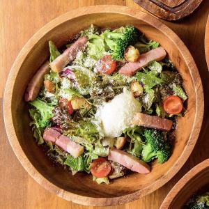 Caesar salad with thick-sliced bacon and soft-boiled egg