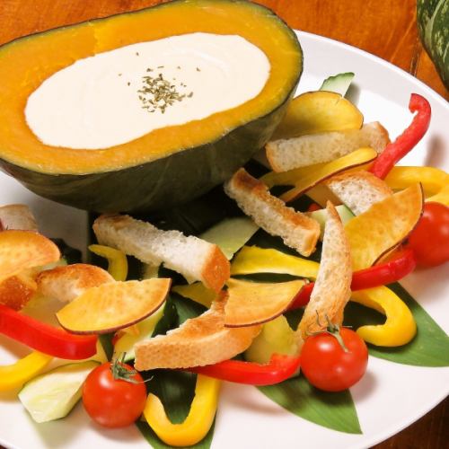 Whole pumpkin cheese fondue (with bucket and vegetables)