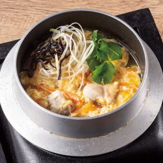 Chicken porridge served in a pot