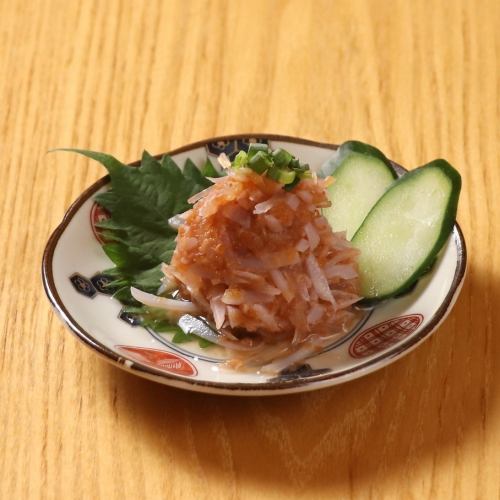 Shark cartilage and Nanko plum sea crystals served with cucumber