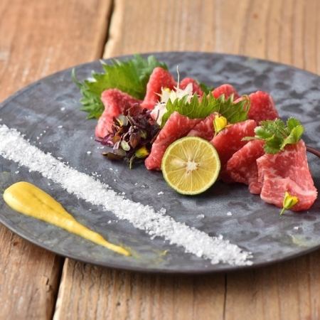 Two pieces of pure raw beef sashimi