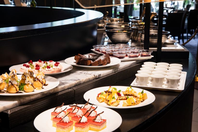 Salads, breads, hot dishes, and desserts are served buffet style.