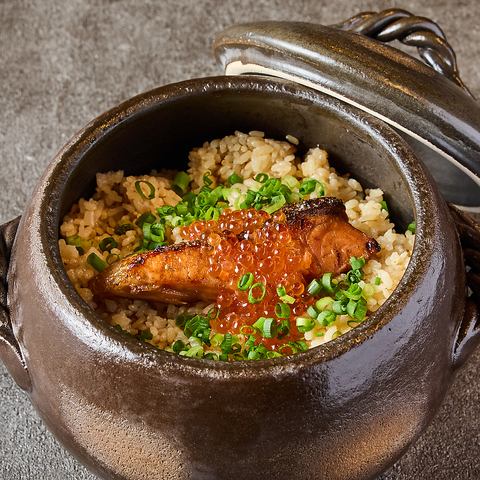 Salmon and salmon roe rice in clay pot