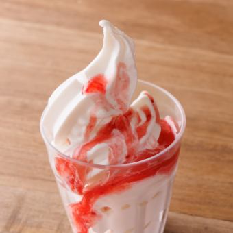 Soft serve ice cream with strawberry sauce