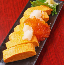 Rolled egg with spilled salmon roe