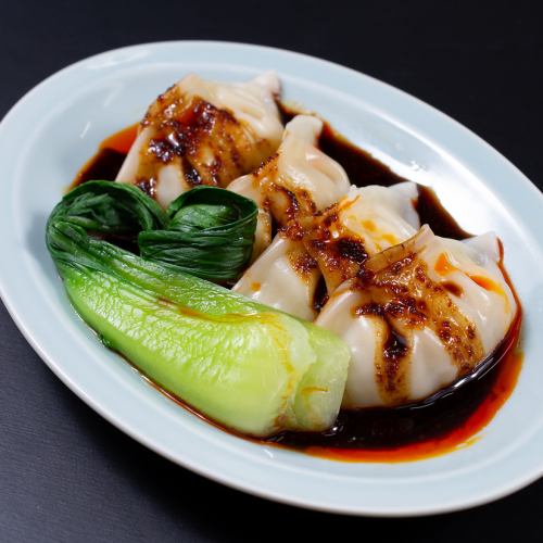 Black and spicy dumplings (4 pieces)
