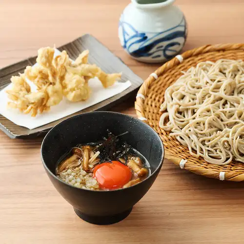 Three kinds of mushrooms and grated yam soba noodles with a fried maitake mushroom topping.